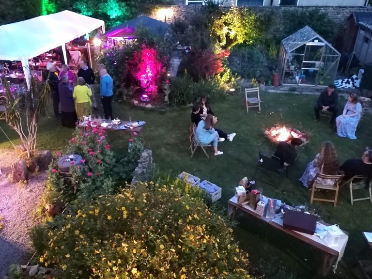 Evening with firepit The evening wedding reception in the garden with a firepit